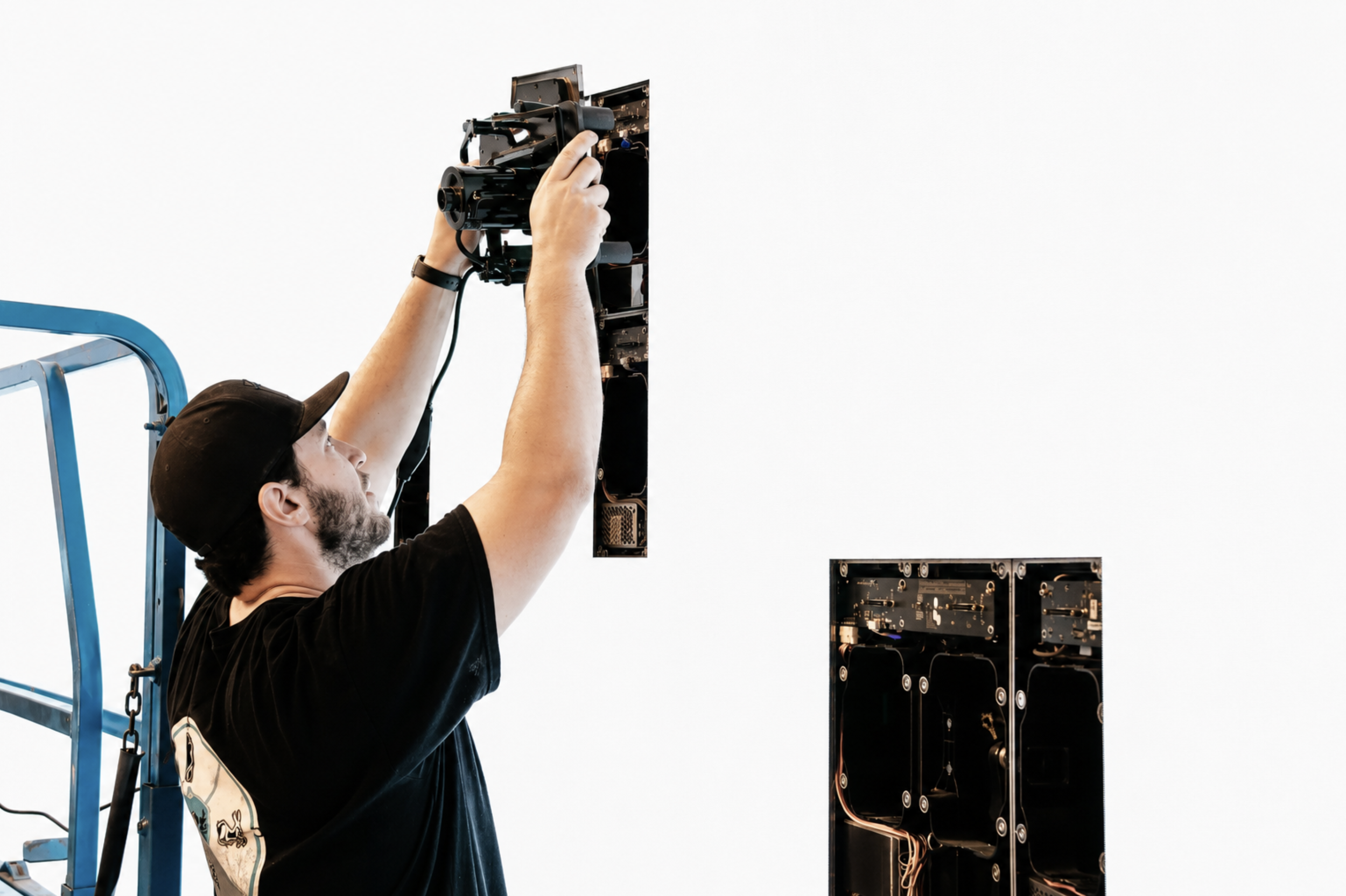 Golden Hour employee performing maintenance on the LED volume wall in the virtual production studio.