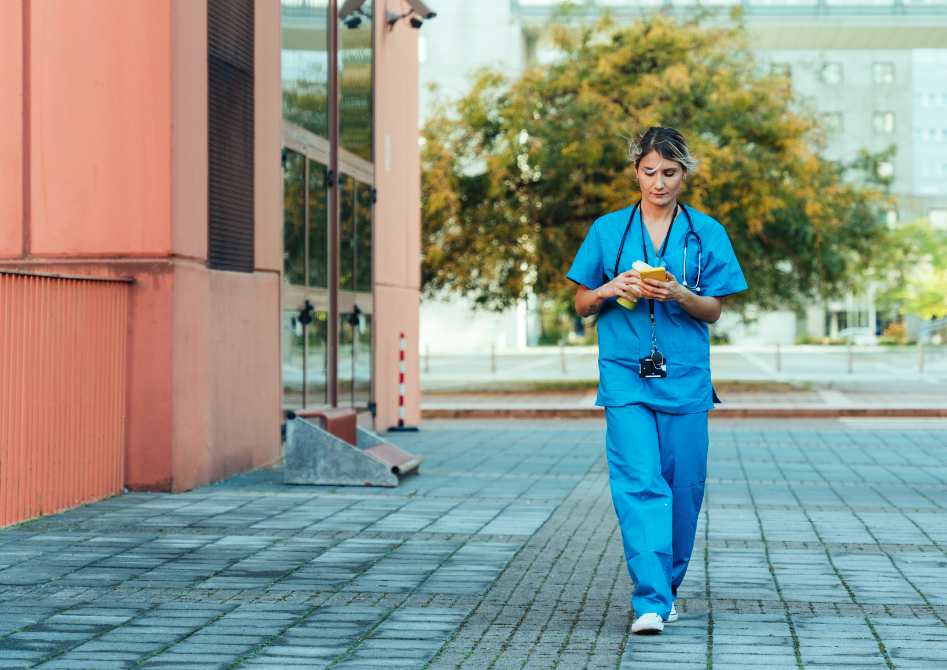 Healthcare worker scrolling on mobile phone