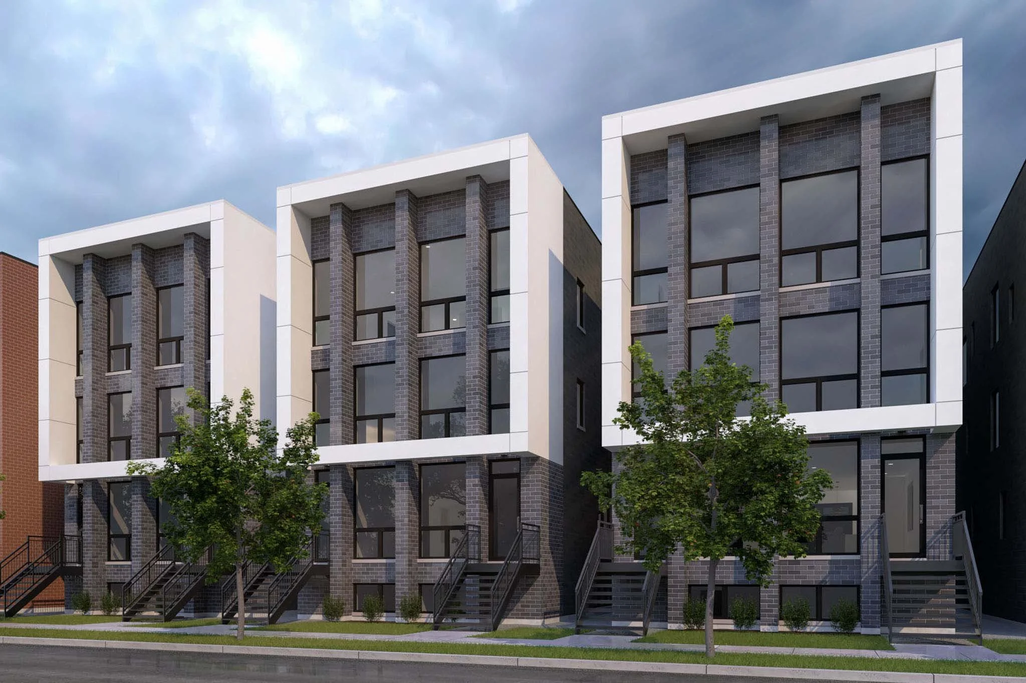 three story condo building with dark brick and white stucco