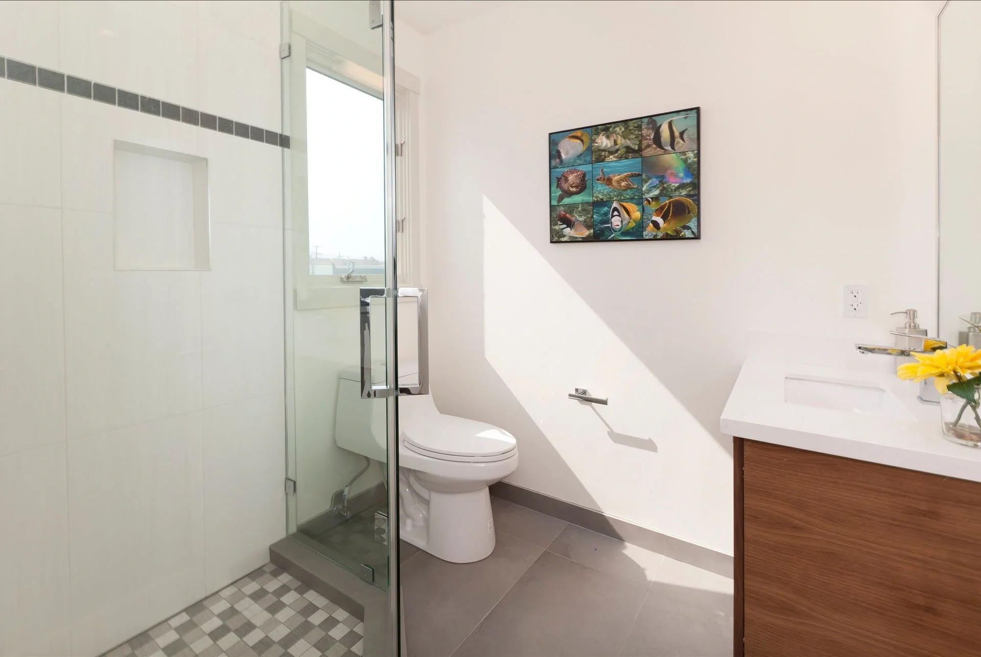 Bathroom remodel in San Francisco Bay Area condo with glass shower, modern fixtures, and tile finishes — general contractor