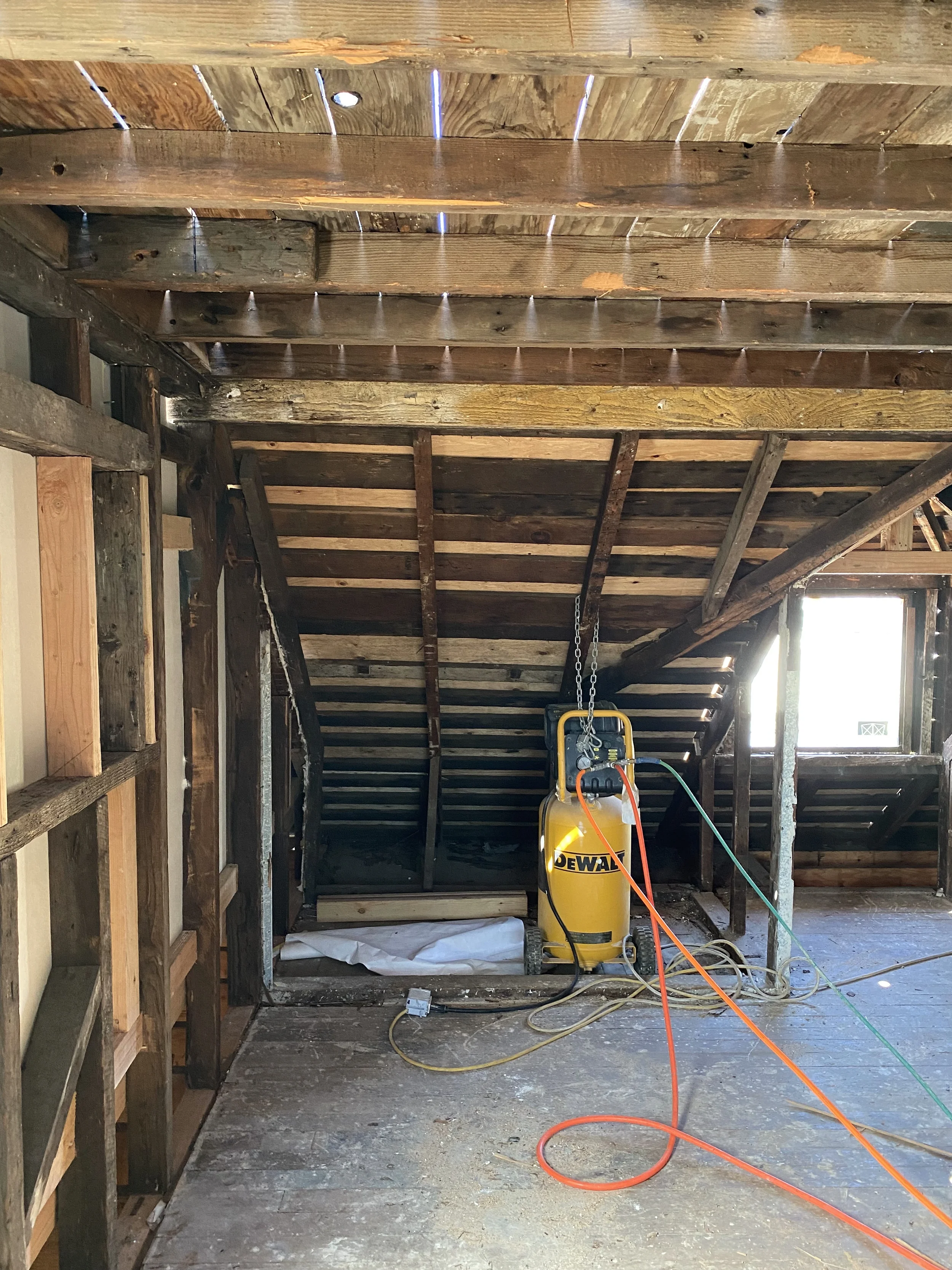 Detached ADU interior construction space with exposed framing and temporary equipment — San Francisco Bay Area general contractor