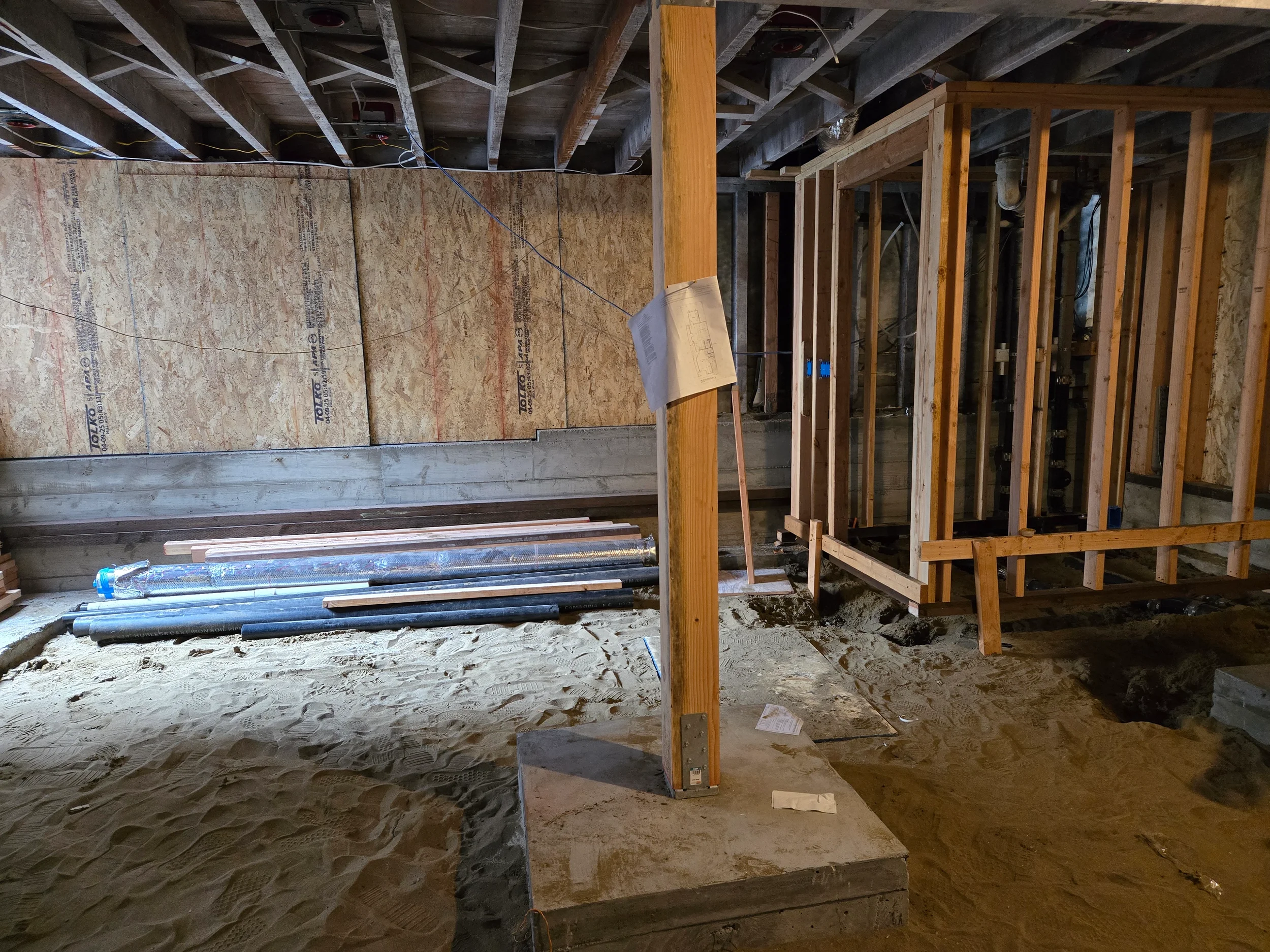 Partition framing and blocking in crawlspace for ground-floor conversion build-out — San Francisco Bay Area general contractor