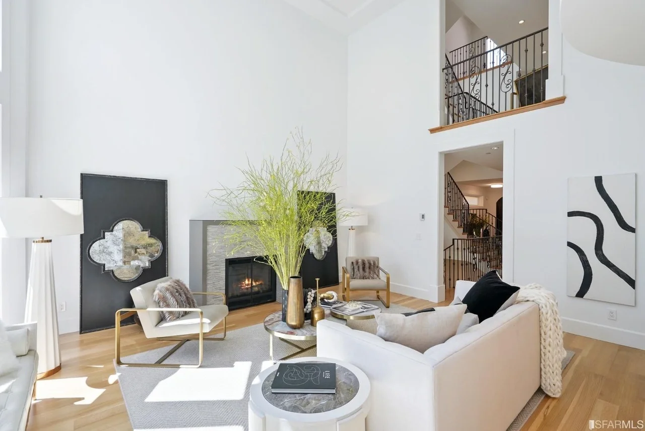 Open-concept living room upgrade featuring tall windows, natural light, and clean modern finishes, open living room remodel with tall windows and modern finishes — San Francisco Bay Area general contractor.