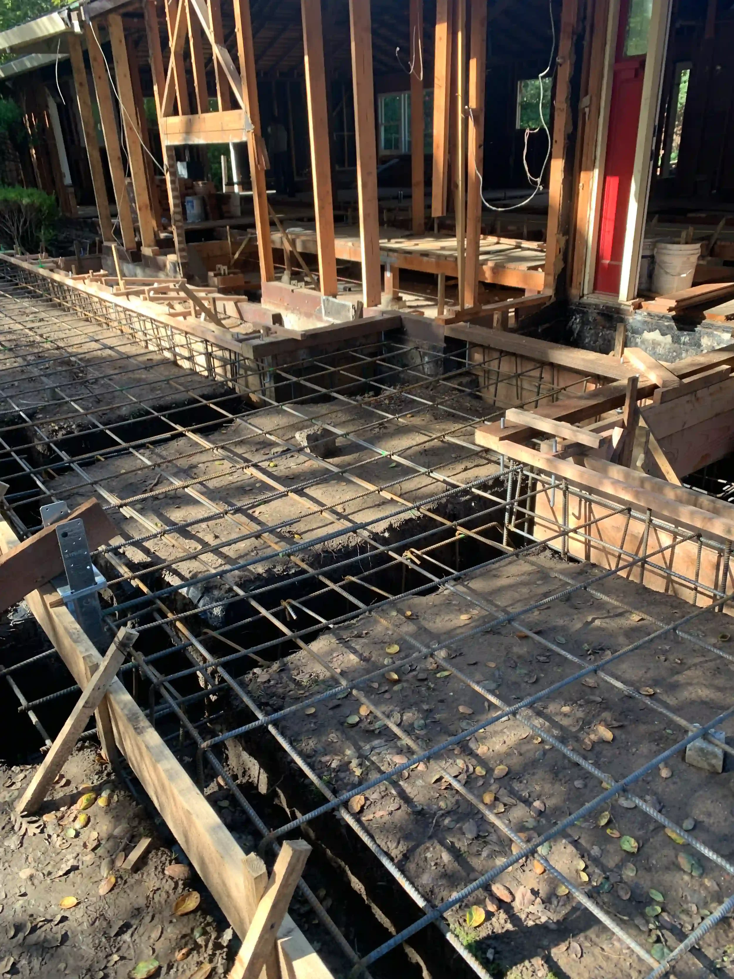 Foundation prep with rebar grid ready for concrete pour — San Francisco Bay Area general contractor