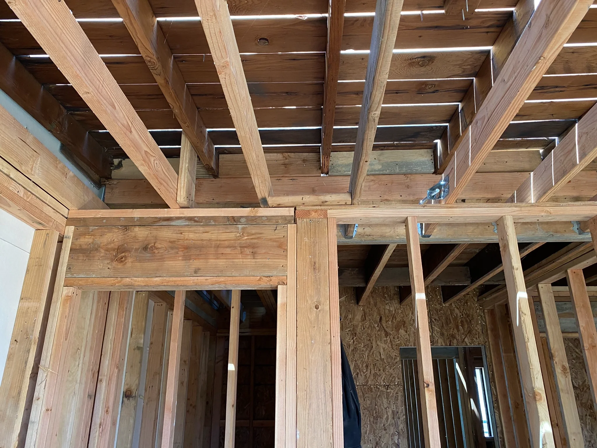Two-story detached ADU construction in progress showing interior framing and structural layout — San Francisco Bay Area general contractor