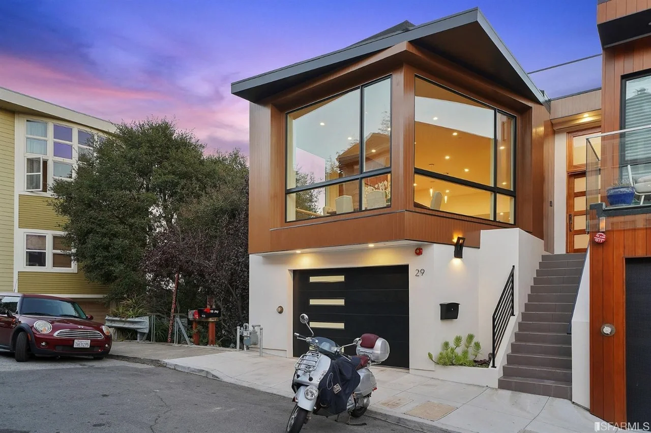 Front exterior view of single-family home addition with modern window box — San Francisco Bay Area general contractor