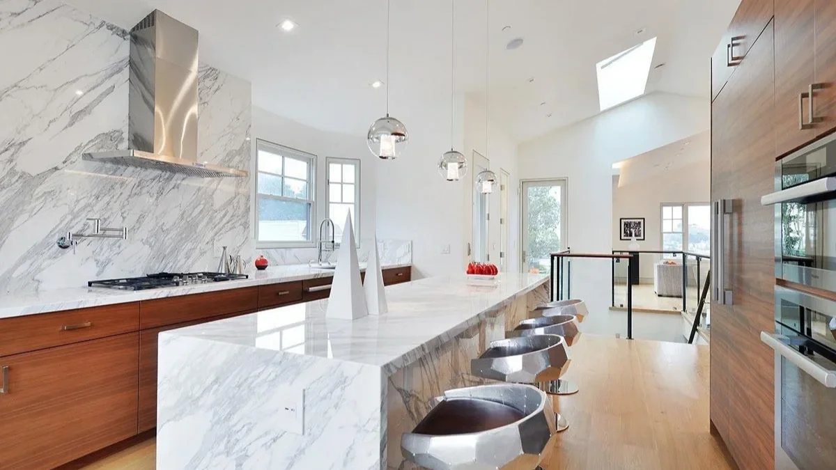 modern kitchen with hanging lights and granite countertop—SF Pinnacle General Contractor