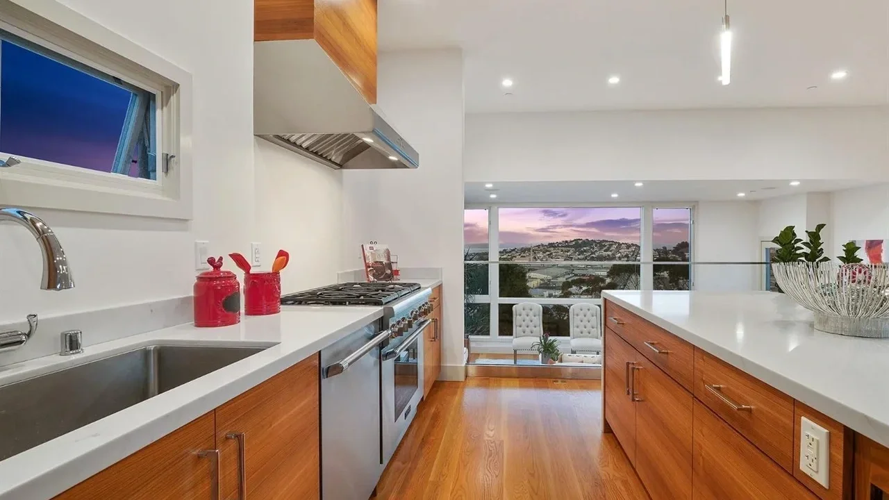 kitchen upgrade with new stovetop and oven next to balcony view—SF Pinnacle General Contractor