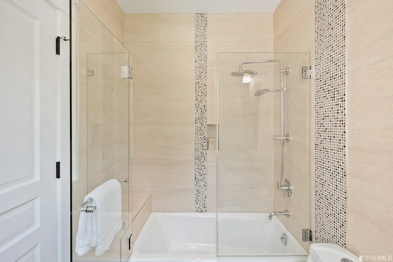 Tub and shower renovation with light tile surround — San Francisco Bay Area general contractor.