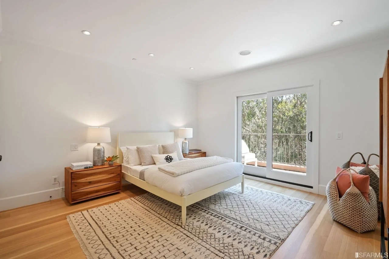Bedroom renovation with hardwood floors and large sliding doors — San Francisco Bay Area general contractor.