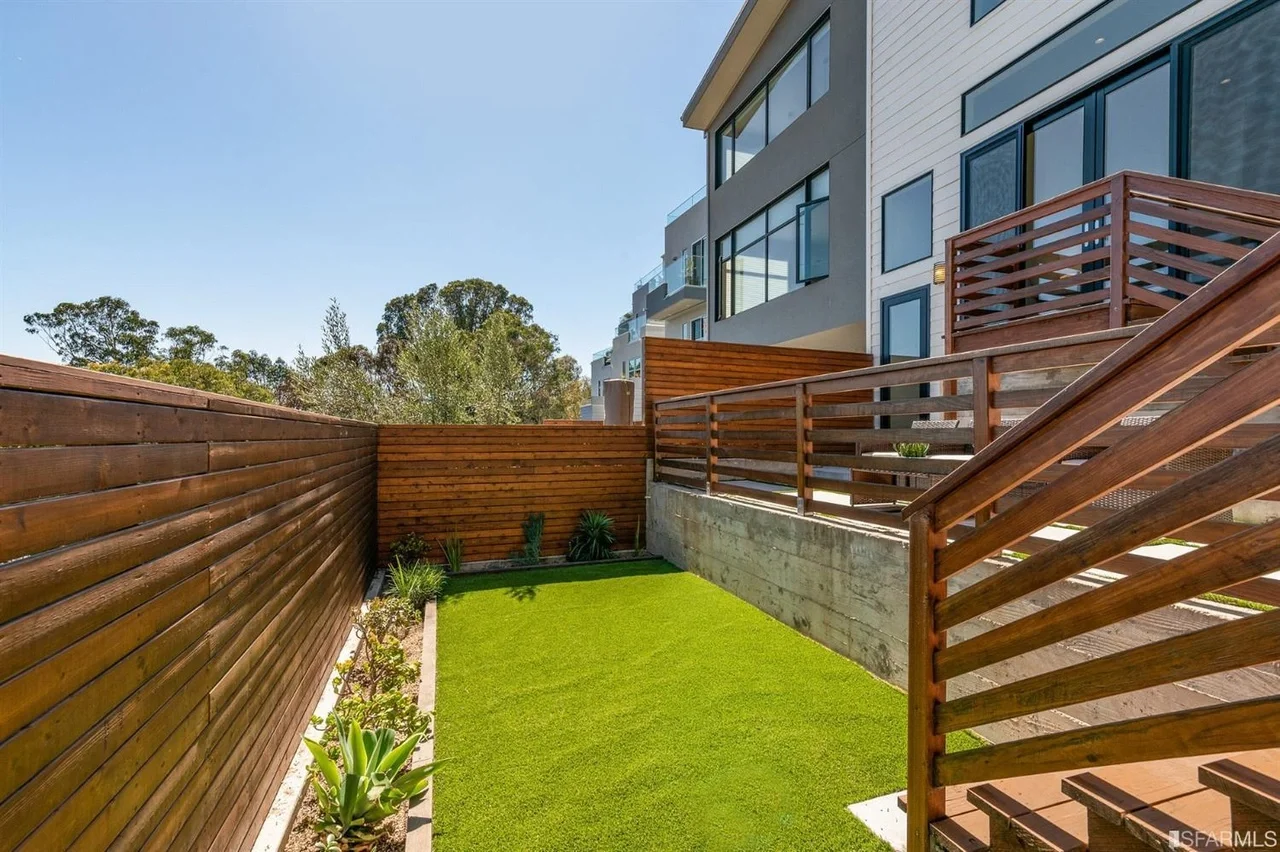 Fenced backyard lawn with new grading and landscaping — San Francisco Bay Area general contractor