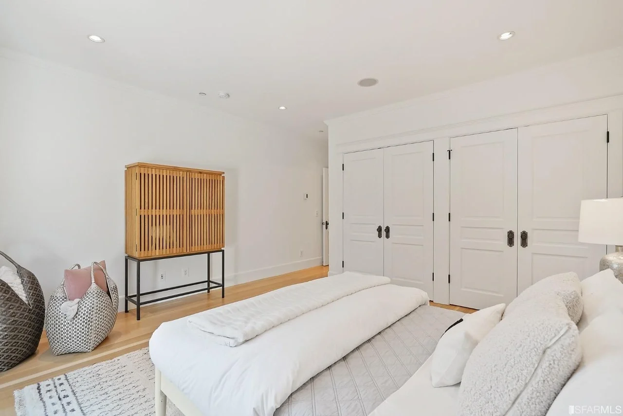 Bedroom remodel with closet wall storage and bright finishes — San Francisco Bay Area general contractor.