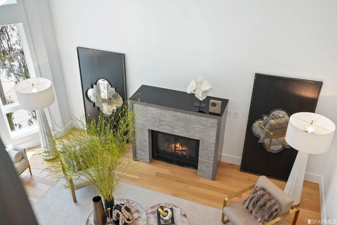 Modern fireplace renovation with updated surround and hearth — San Francisco Bay Area general contractor.