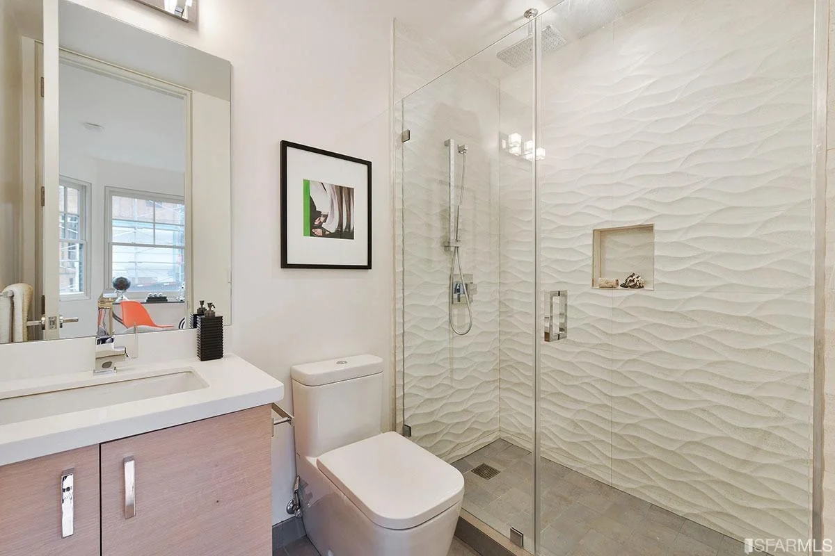 bathroom with glass shower enclosure and marble tile — San Francisco Bay Area general contractor