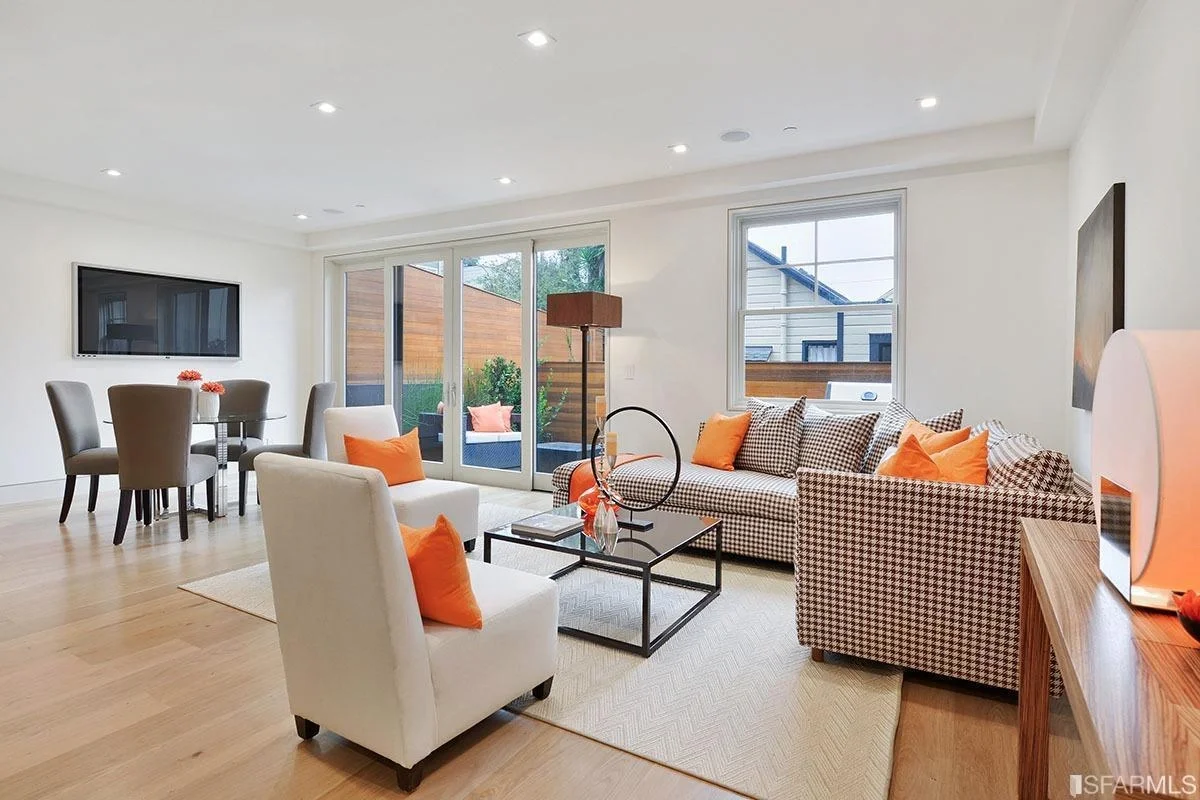 Family room in home addition with sliding glass doors, hardwood floors, and updated finishes — San Francisco Bay Area general contractor