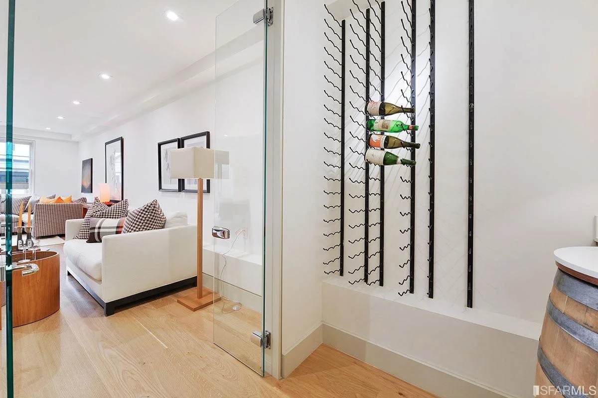 Custom wine storage feature with modern racking and wood detailing — San Francisco Bay Area general contractor