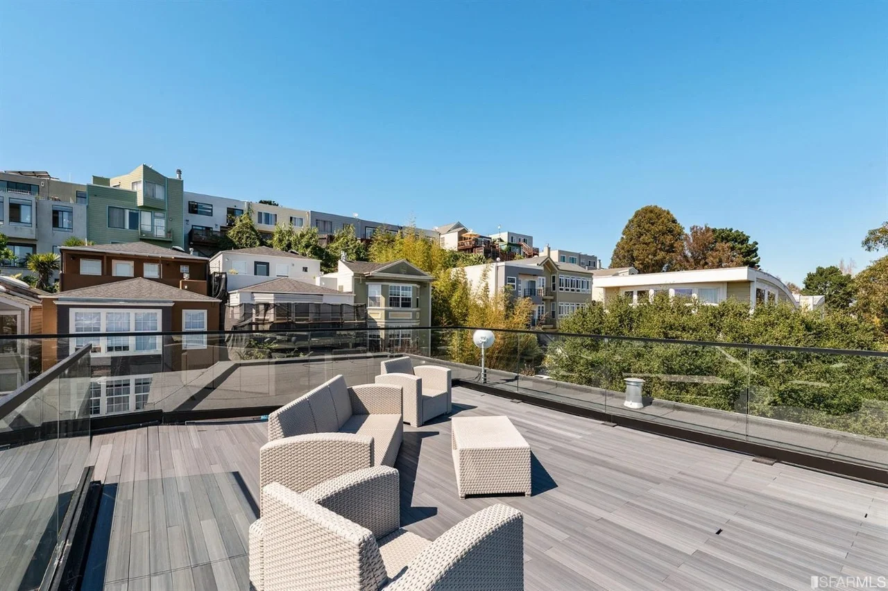 Rooftop terrace seating with skyline views — single-family home addition — San Francisco Bay Area general contractor