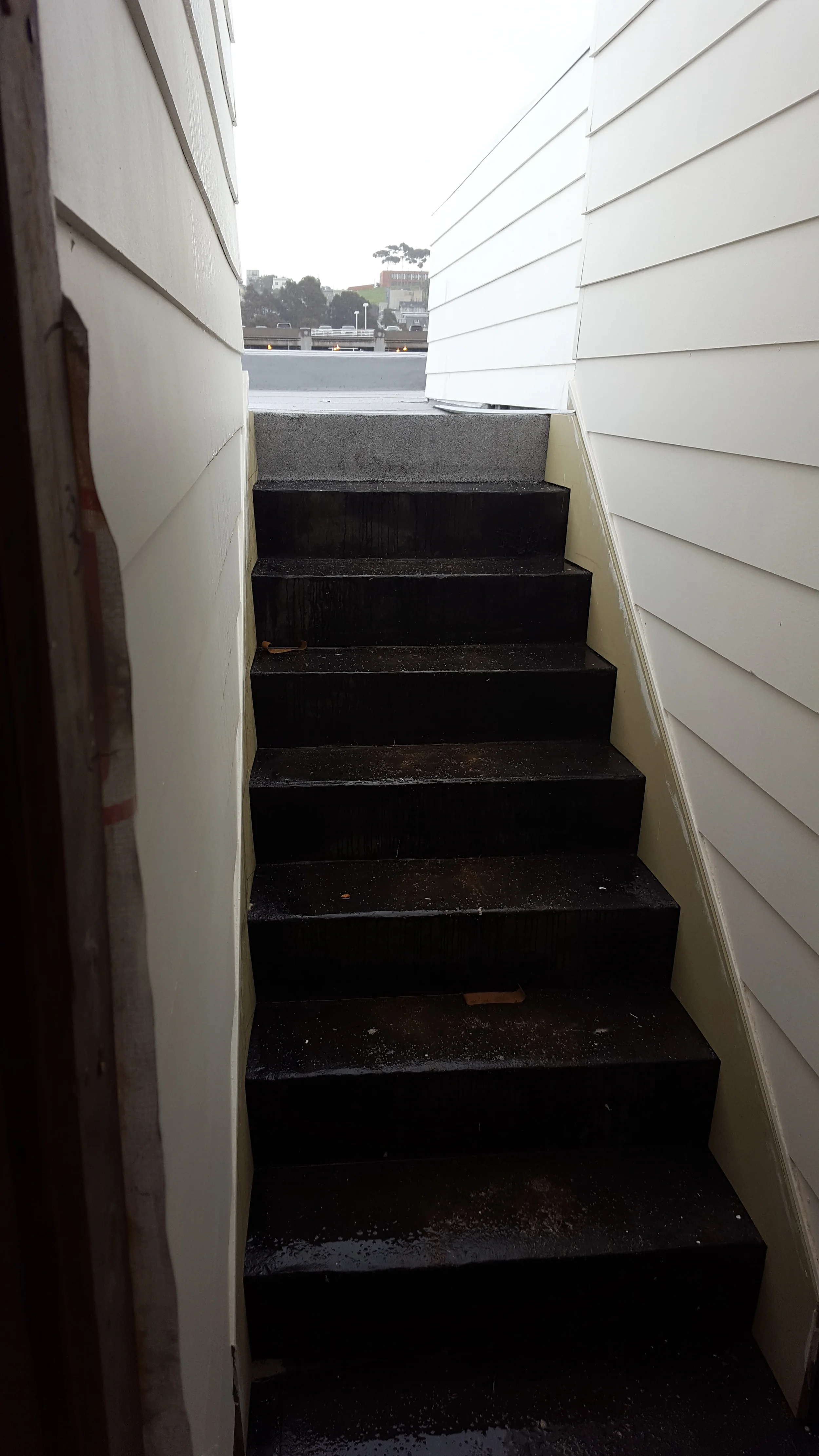 Stair construction progress with temporary steps during condo remodel — San Francisco Bay Area general contractor