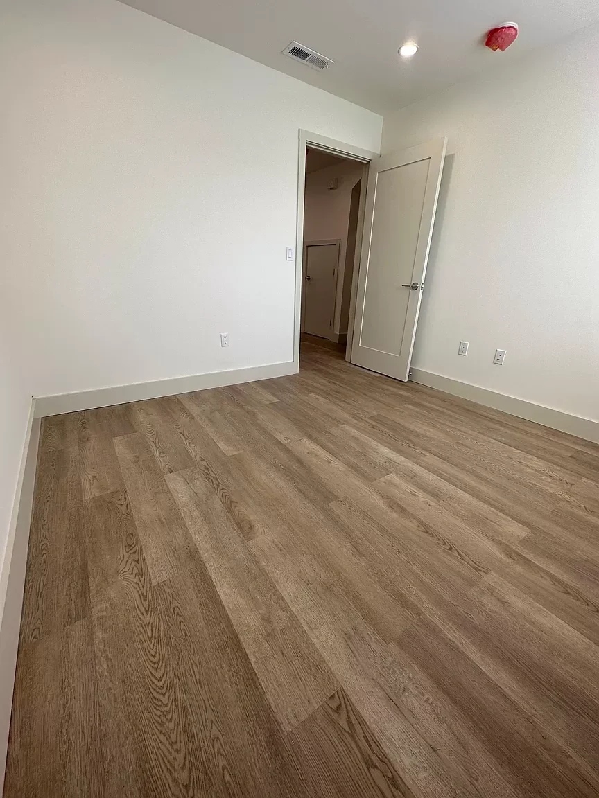 Detached ADU interior room with new flooring and fresh white walls — San Francisco Bay Area general contractor