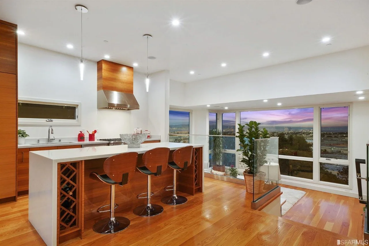 Open kitchen remodel with island seating and wood cabinetry — home addition — San Francisco Bay Area general contractor