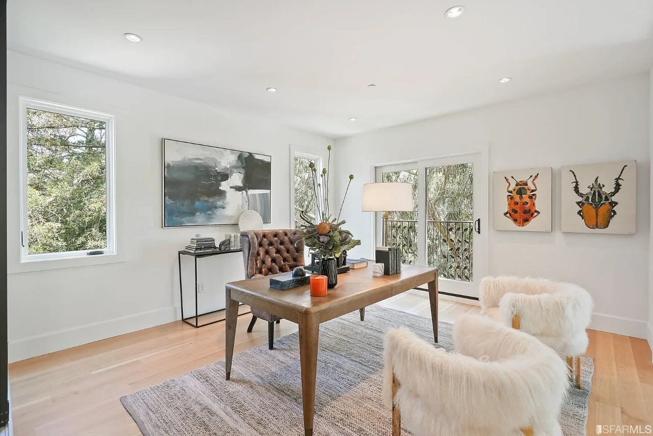 Open-concept living space renovation with hardwood floors and recessed lighting — San Francisco Bay Area general contractor.