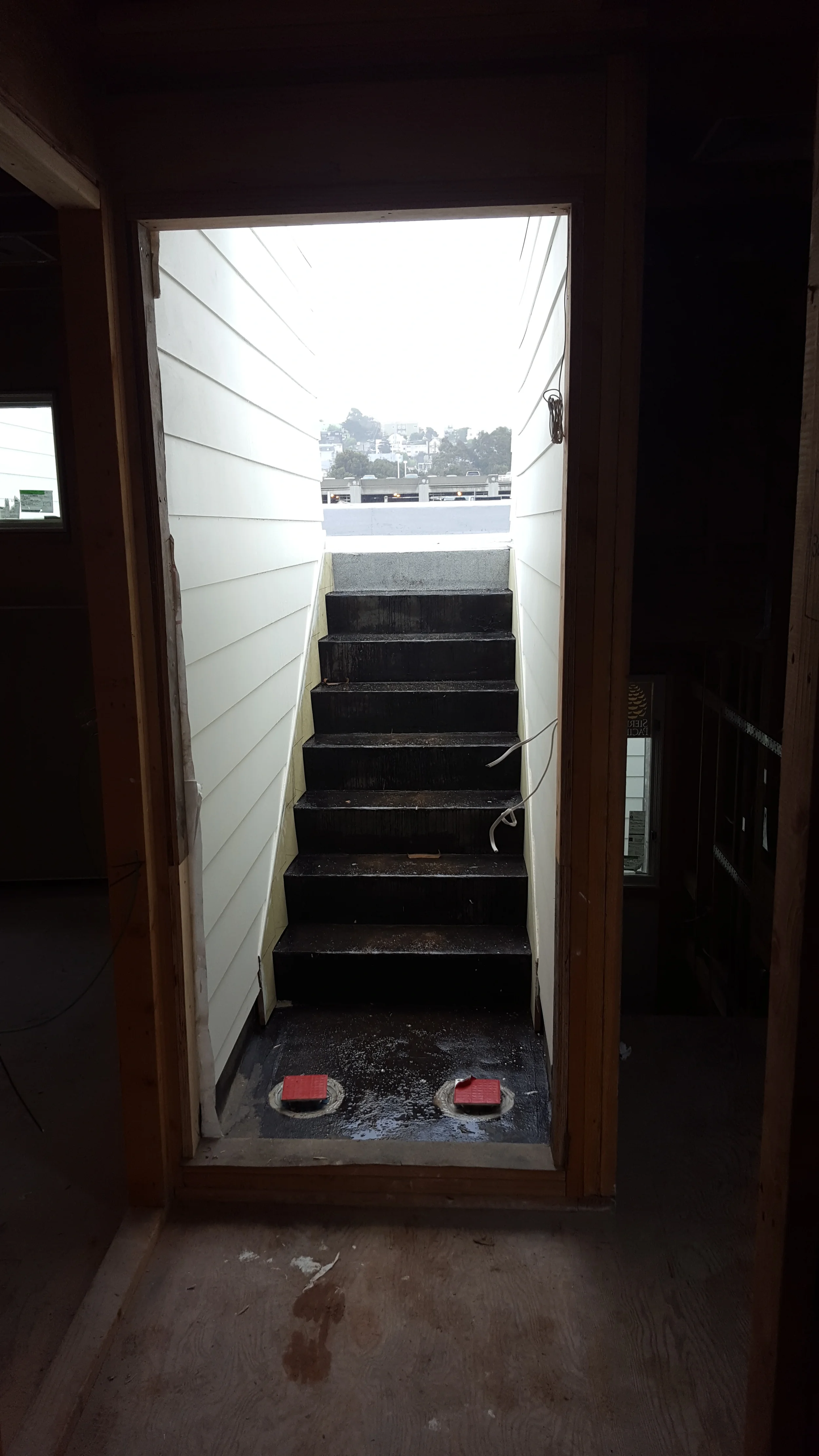 Renovation stairwell showing unfinished steps and active work area — San Francisco Bay Area general contractor