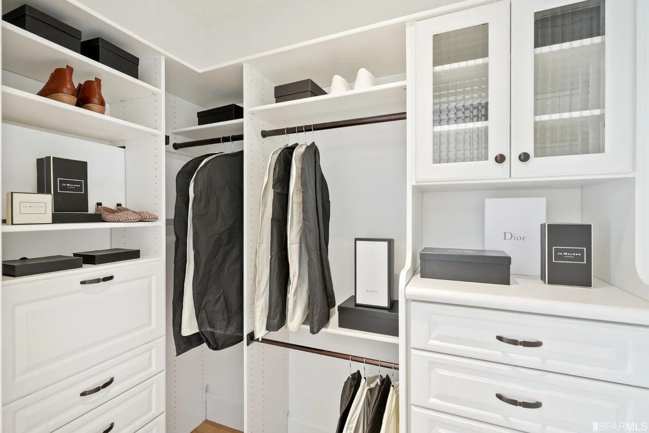 Walk-in closet renovation with custom built-in shelving and hanging storage — San Francisco Bay Area general contractor.