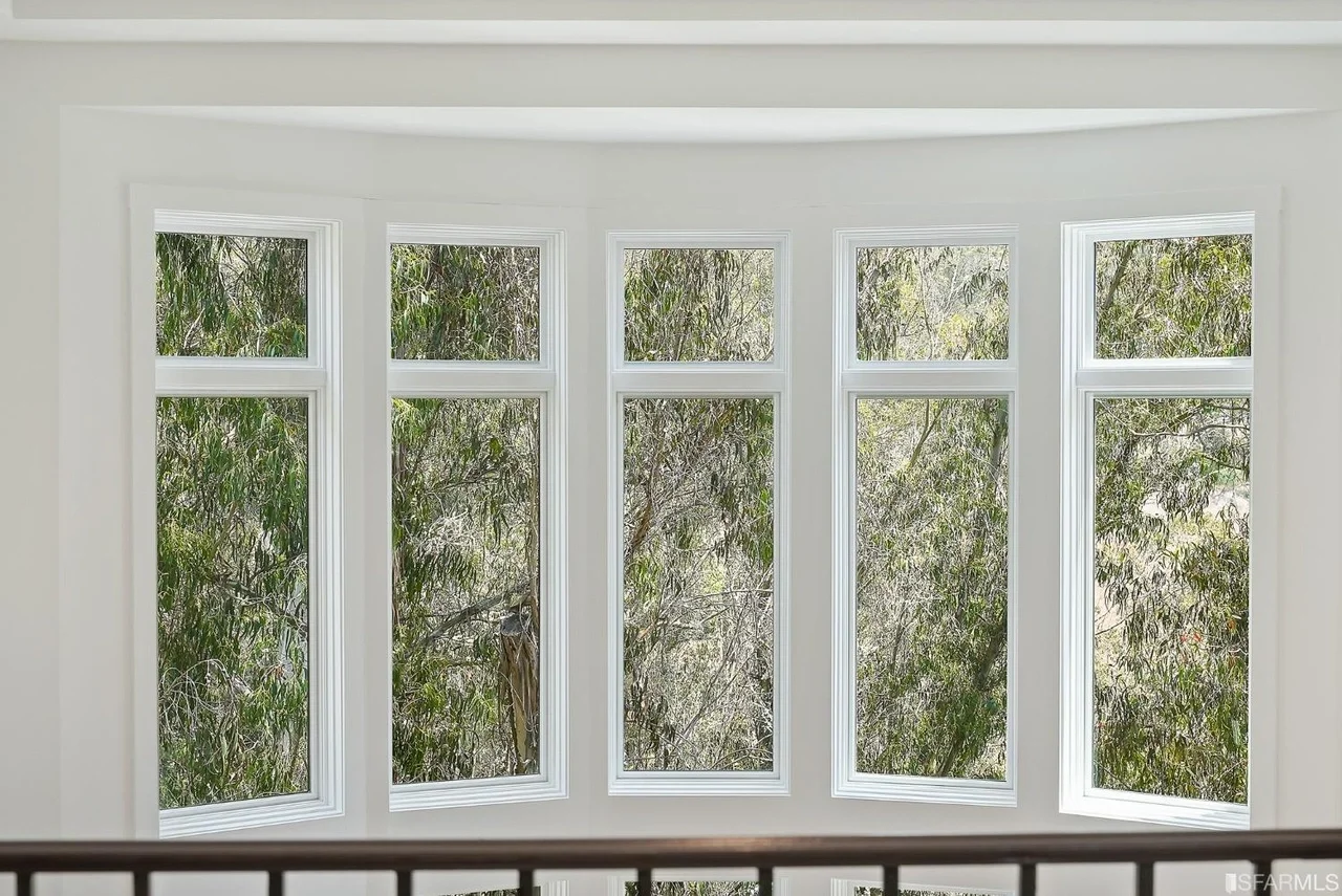 Large window wall with updated trim bringing in natural light — San Francisco Bay Area general contractor.