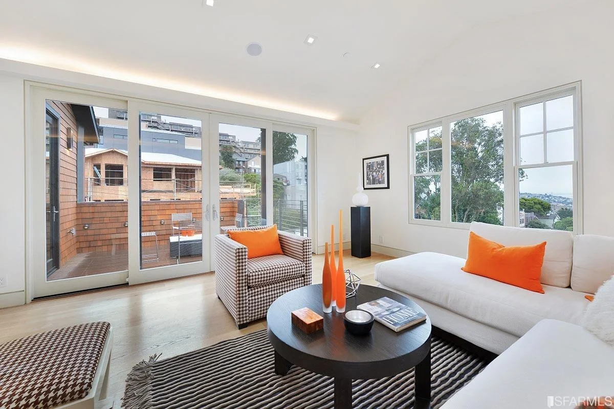 Entry foyer in single-family home addition with modern front door and hardwood floors — San Francisco Bay Area general contractor
