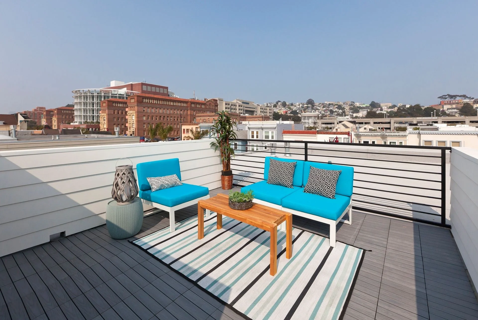 Rooftop deck renovation with outdoor seating and city views — San Francisco Bay Area condo general contractor