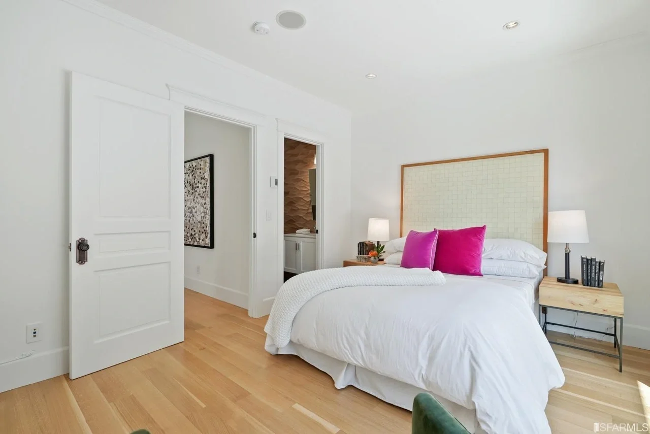 Bedroom remodel with warm wood flooring and fresh finishes — San Francisco Bay Area general contractor.