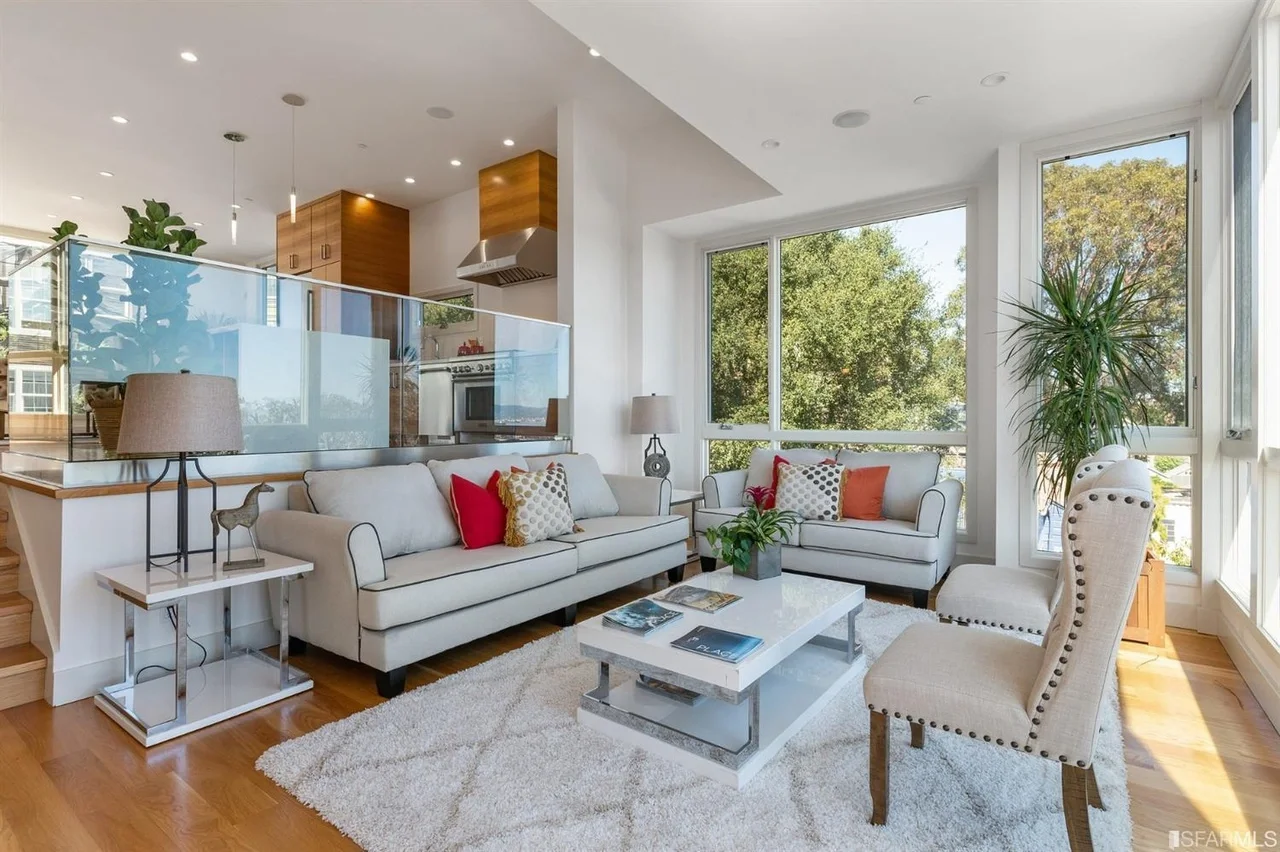 Open great room in single-family home addition with modern seating and recessed lighting — San Francisco Bay Area general contractor