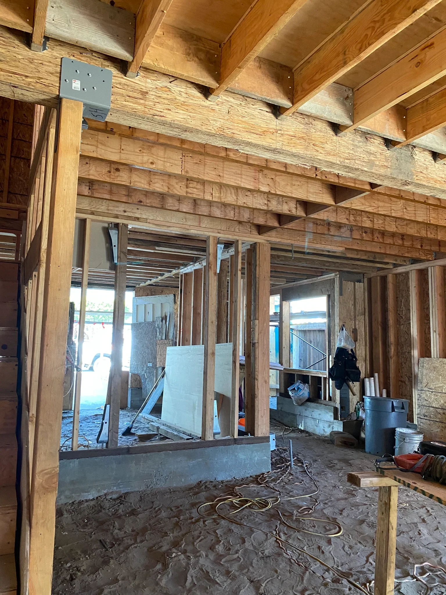 Detached ADU interior framing with exposed studs and joists during build-out — San Francisco Bay Area general contractor