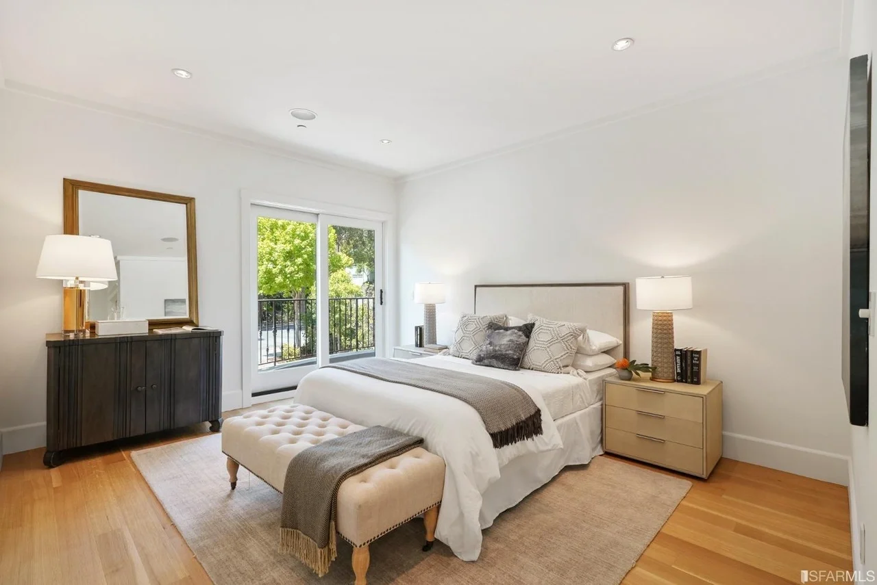 Bedroom renovation with hardwood floors and large windows — San Francisco Bay Area general contractor.