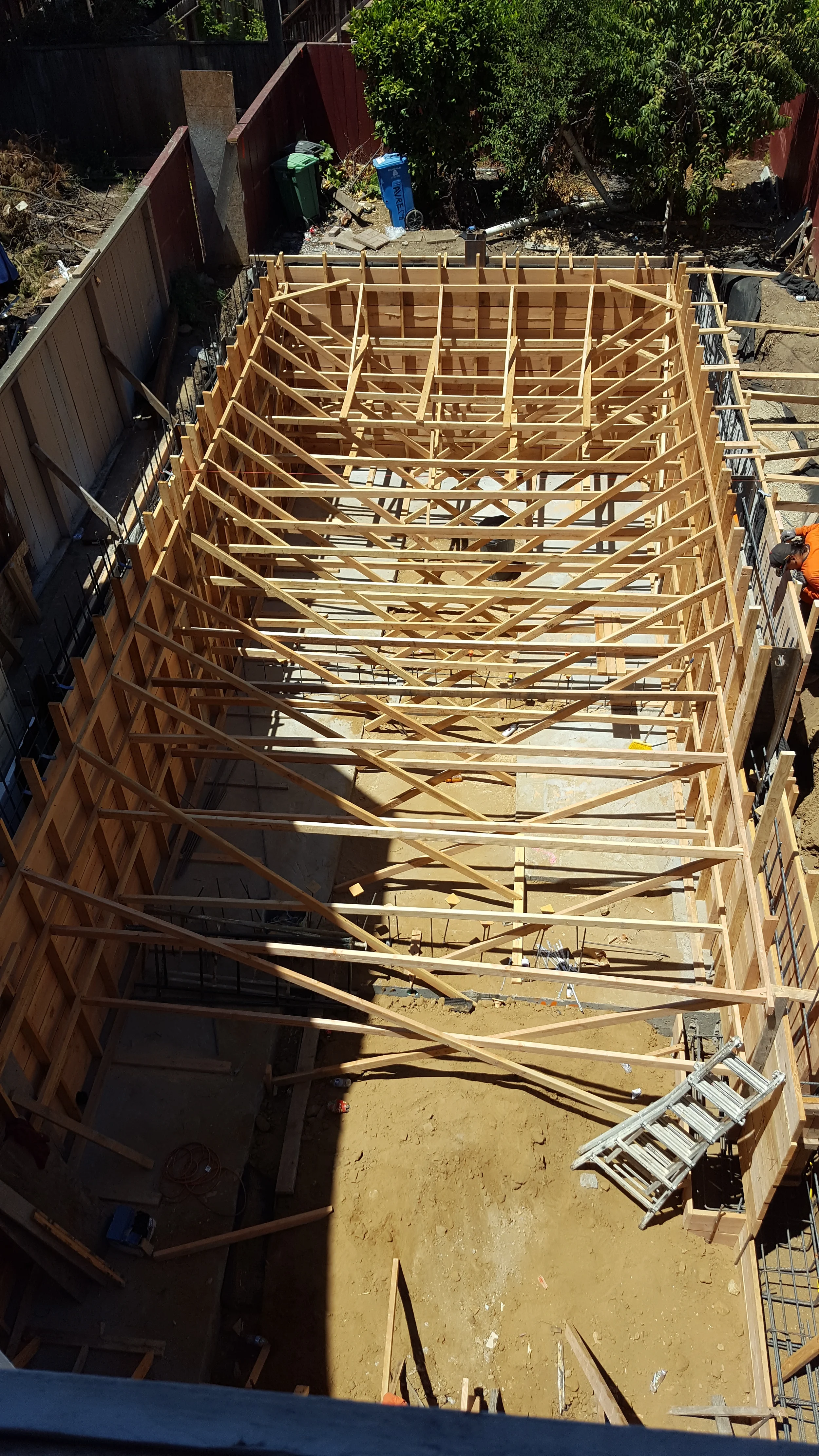 Foundation work in progress with excavation and steel reinforcement (rebar) — San Francisco Bay Area general contractor