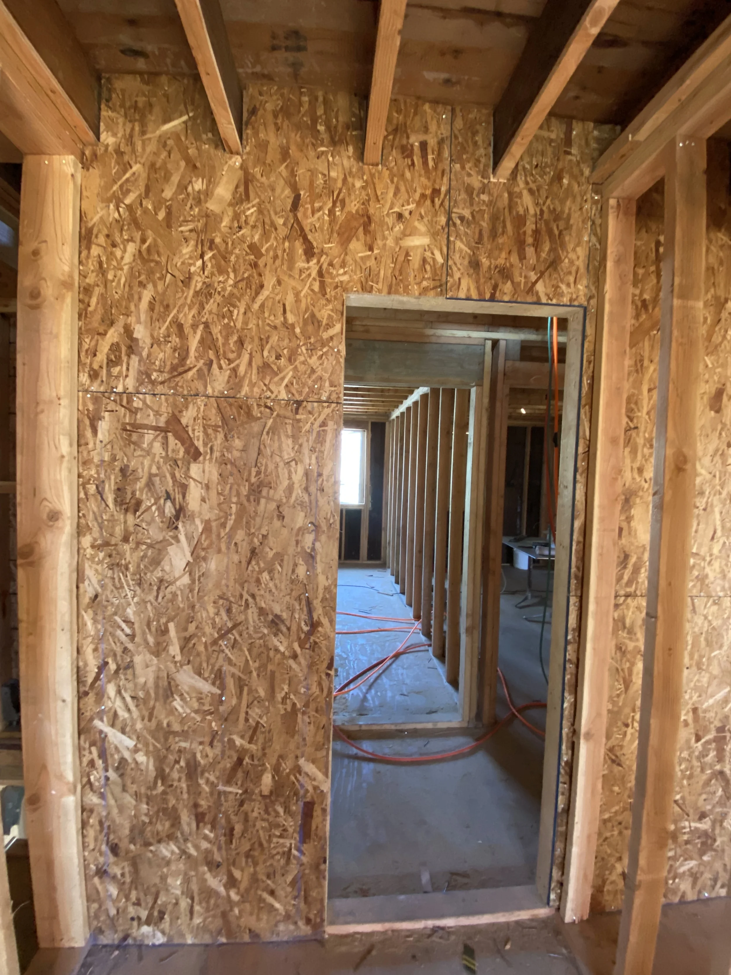 Framed hallway and room openings during two-story detached ADU construction — San Francisco Bay Area general contractor