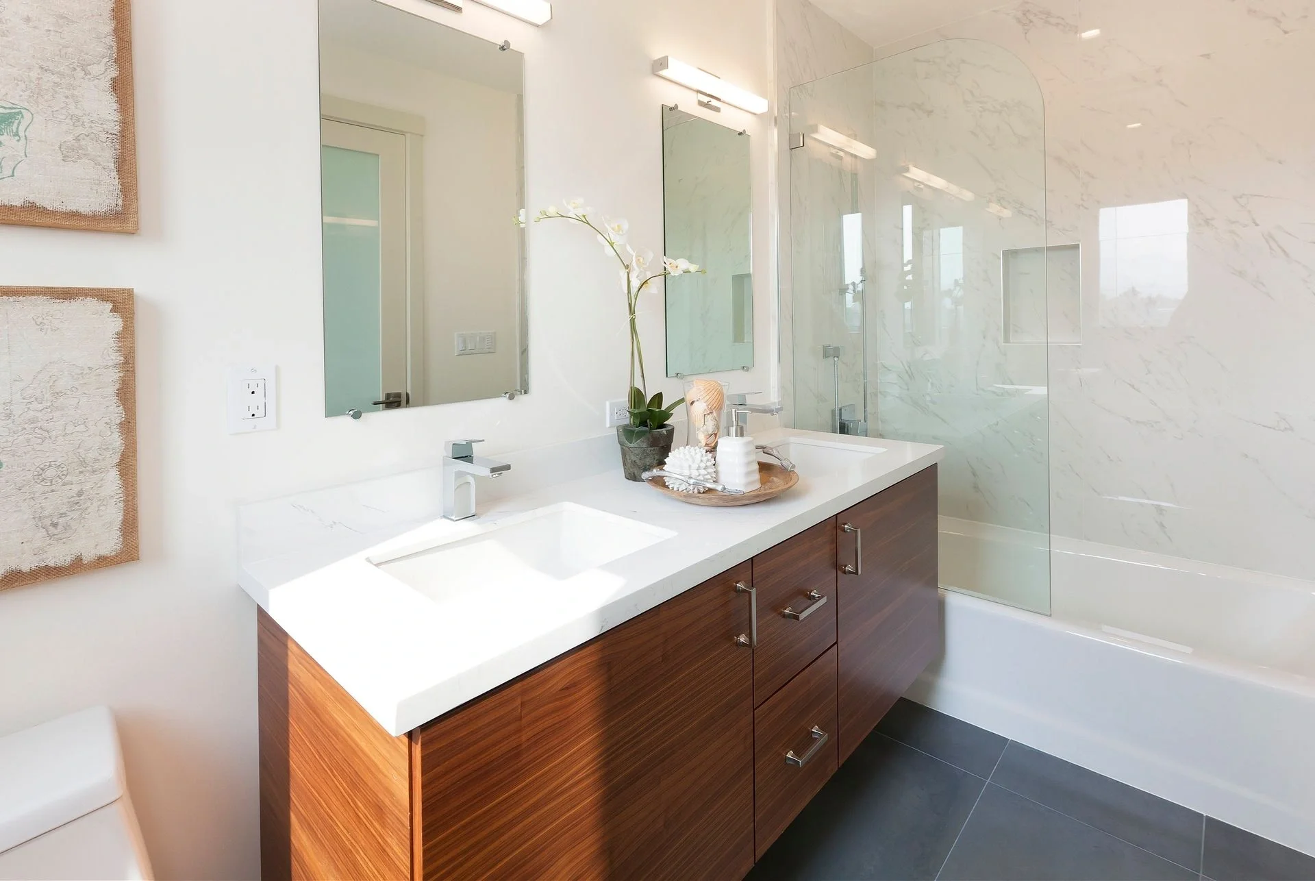 Bathroom renovation with wood vanity, large mirror, and updated tile — San Francisco Bay Area condo general contractor