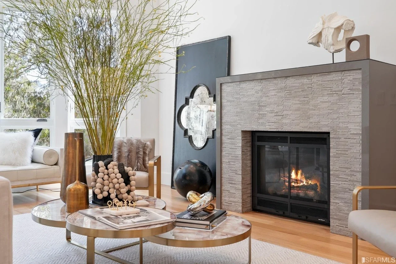 Modern fireplace remodel with sleek tile surround and updated hearth detailing — San Francisco Bay Area general contractor.