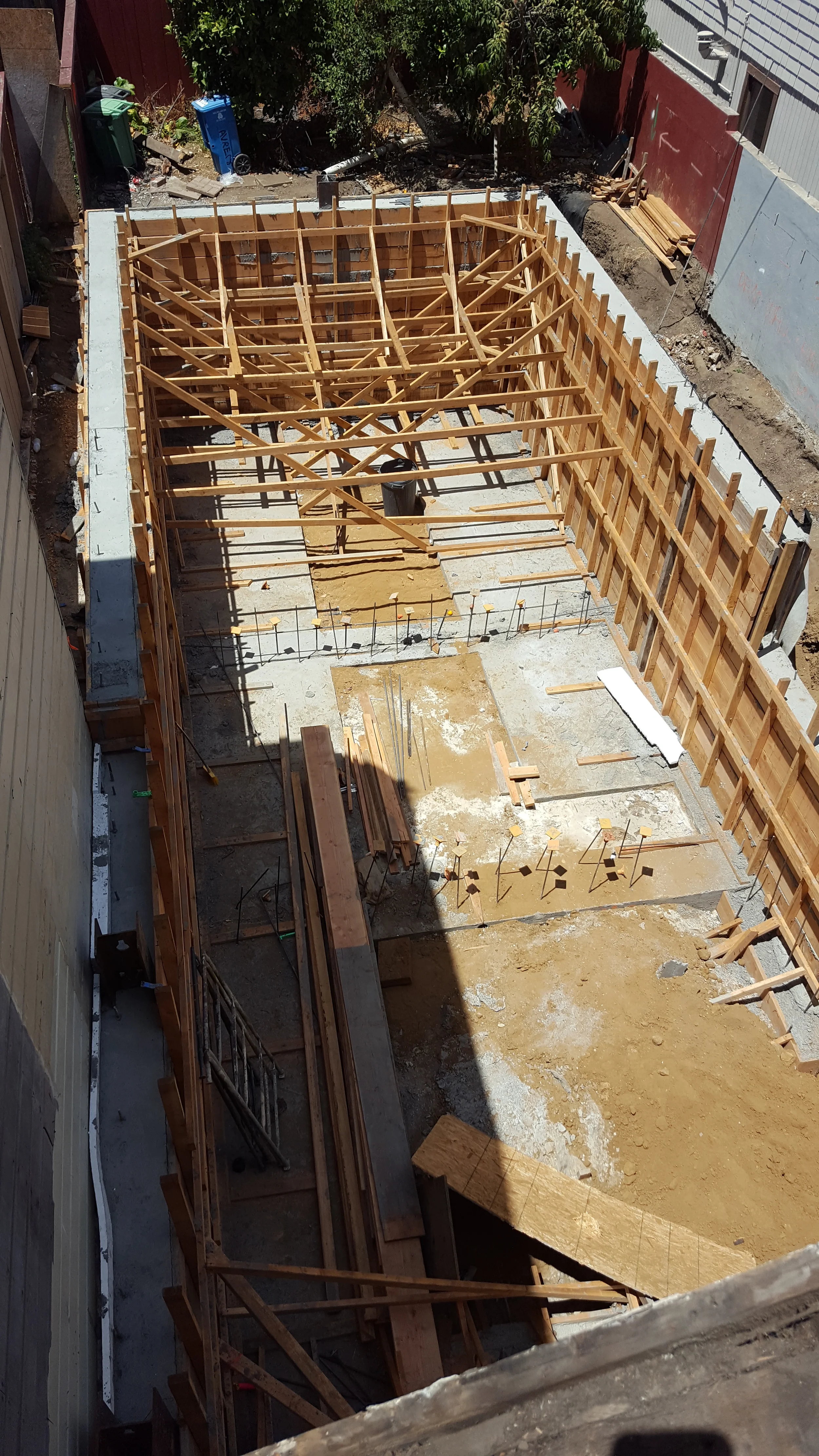 Excavation and formwork for new footings in condo remodel — San Francisco Bay Area general contractor