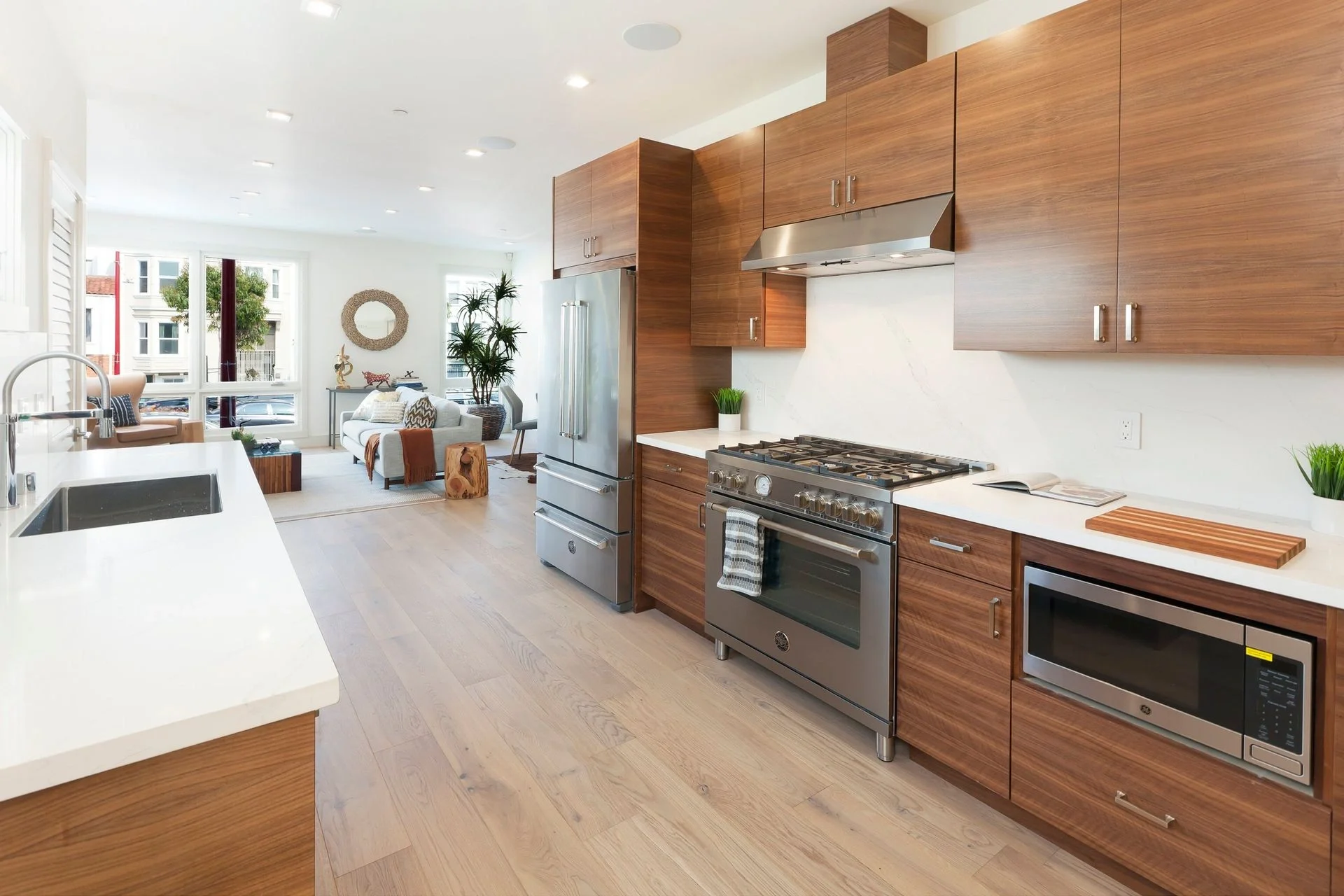 Condo kitchen remodel with wood cabinetry and open layout to living space — San Francisco Bay Area general contractor