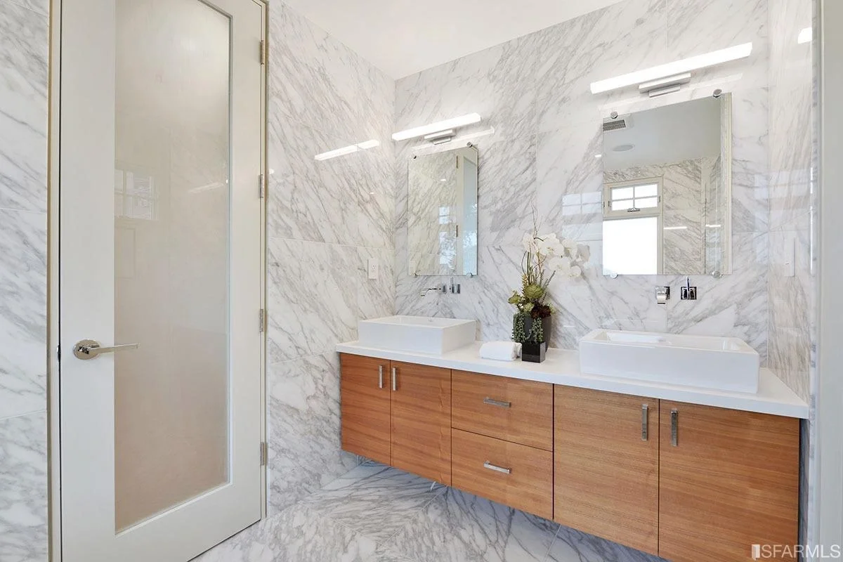 bathroom with double vanity, wood cabinets, and stone countertop — San Francisco Bay Area general contractor