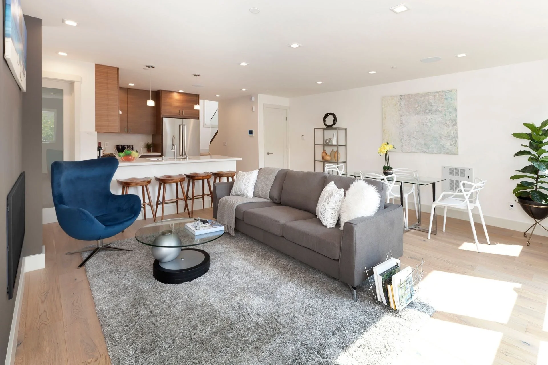 Condo living room renovation with gray sofa, coffee table, and bright natural light — San Francisco Bay Area general contractor