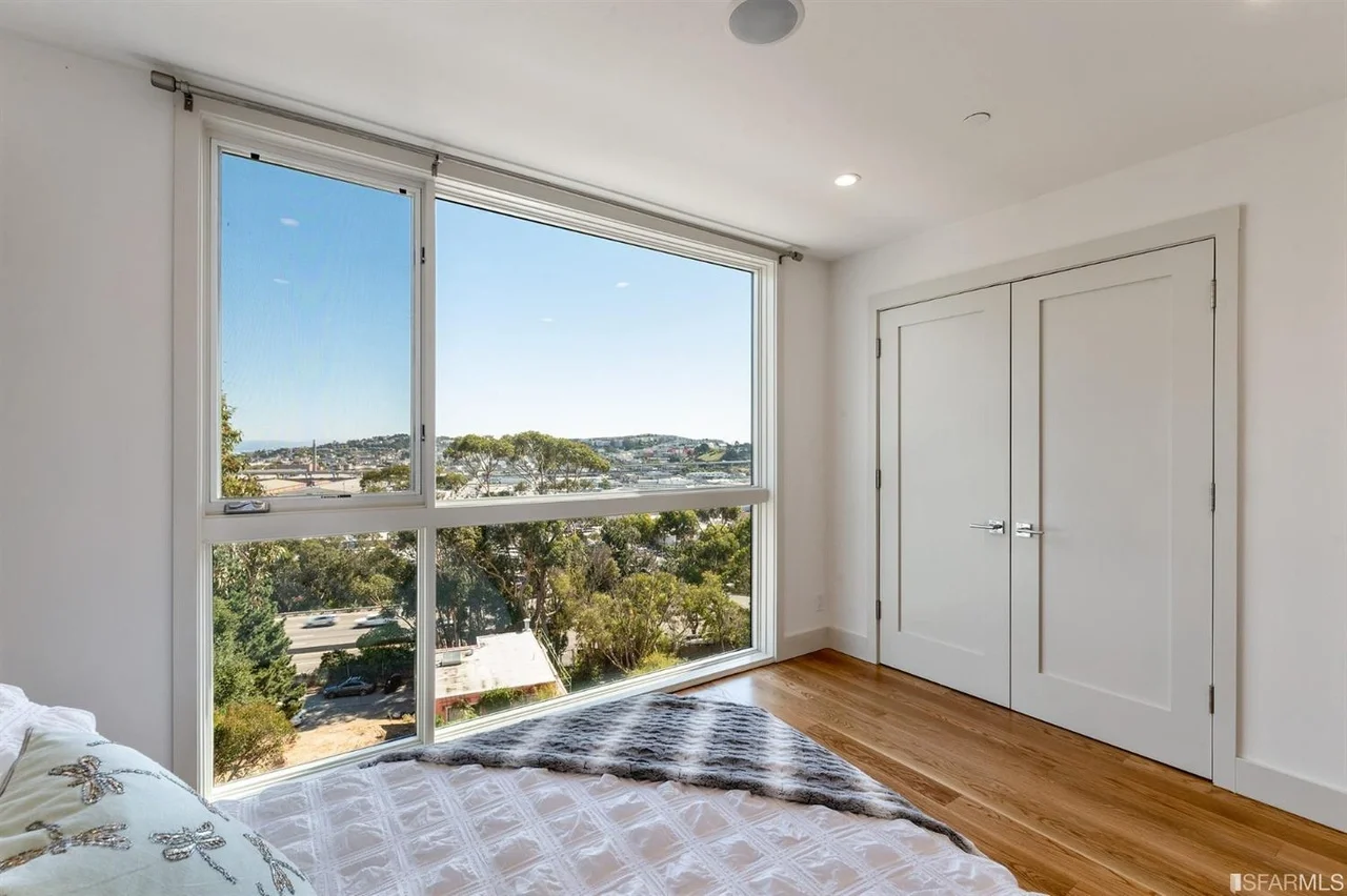 Bedroom in home addition with picture window and Bay Area view — San Francisco Bay Area general contractor