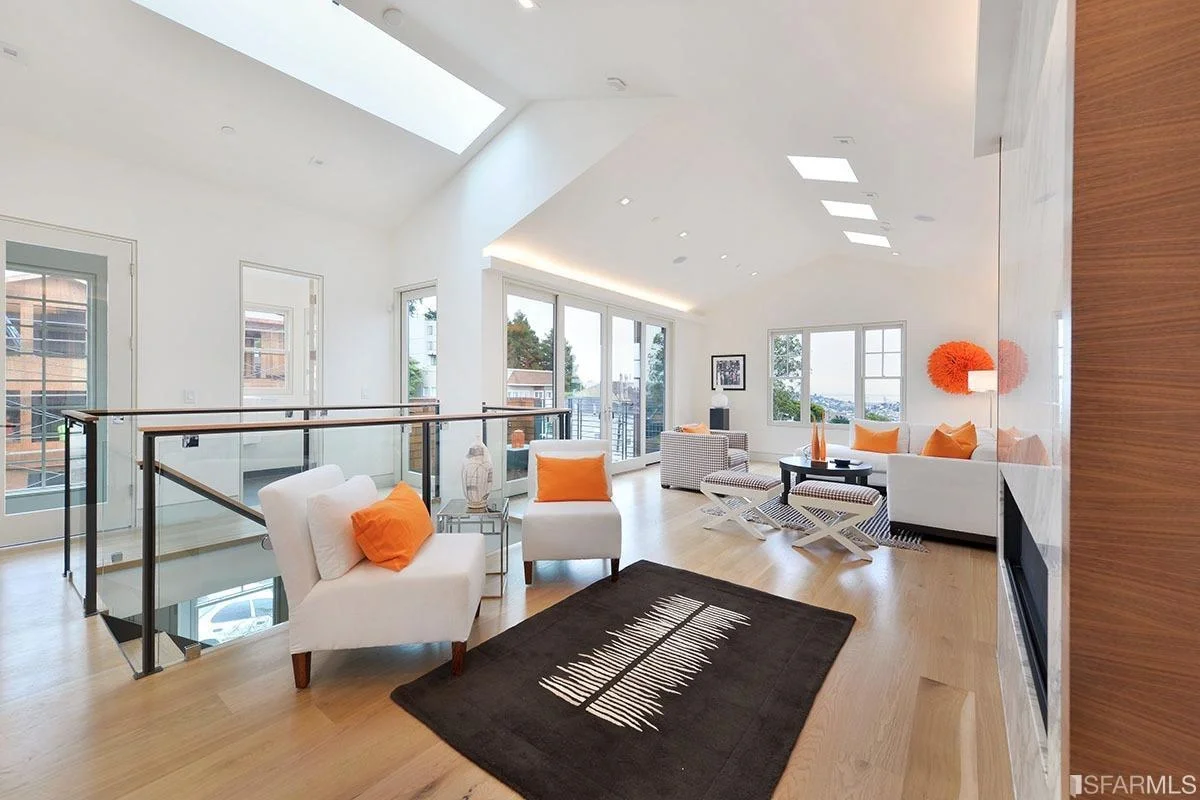Stairwell view in home addition with contemporary railing and bright natural light — San Francisco Bay Area general contractor