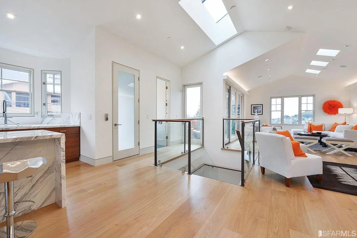 landing with skylights, recessed lighting, and hardwood floors — San Francisco Bay Area general contractor