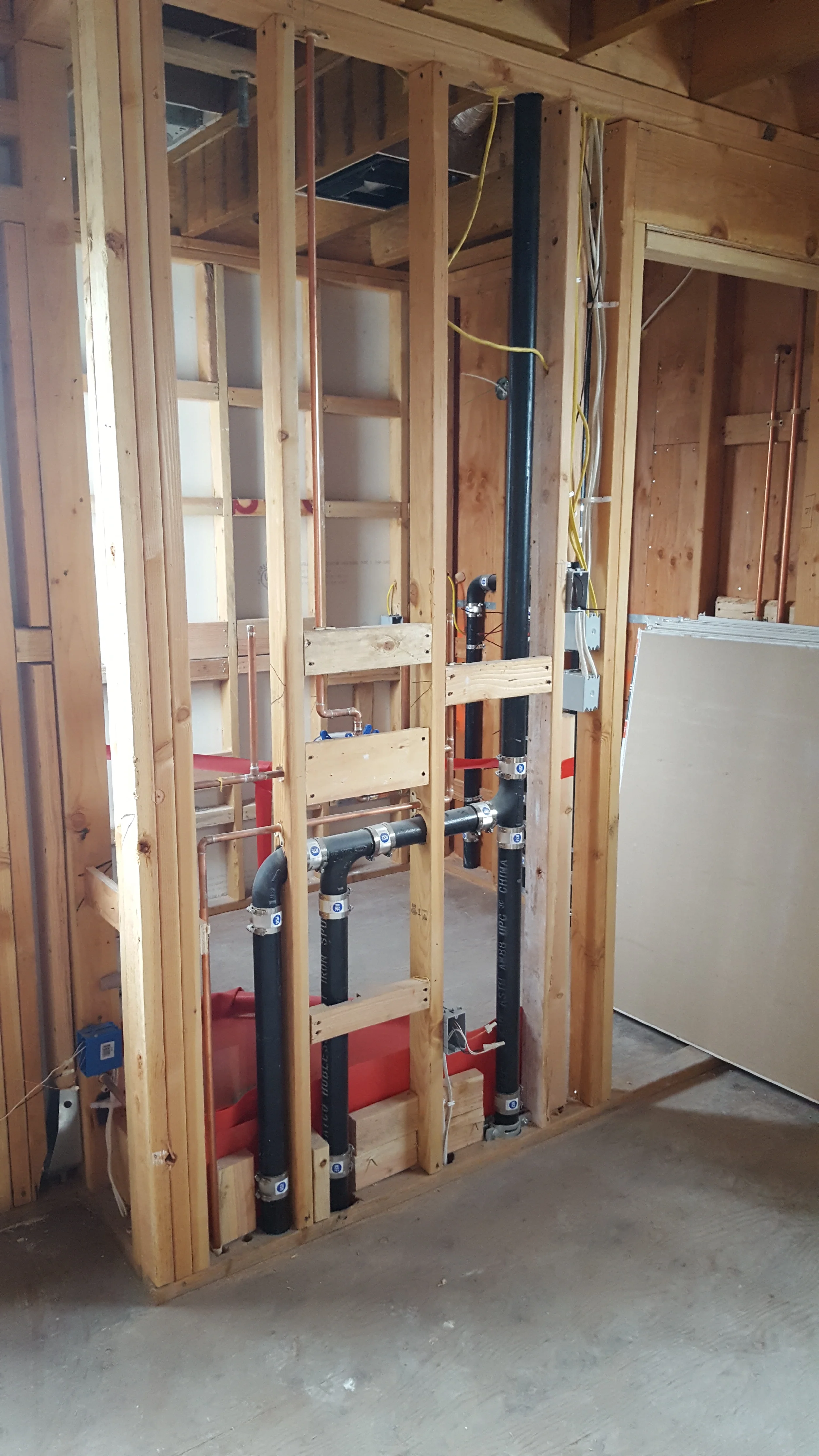 Rough-in plumbing and framing inside condo renovation — San Francisco Bay Area general contractor
