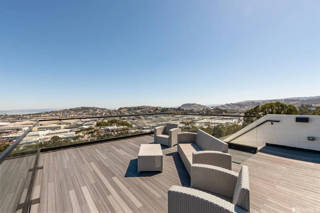 Rooftop lounge area with outdoor seating and city views — home addition — San Francisco Bay Area general contractor