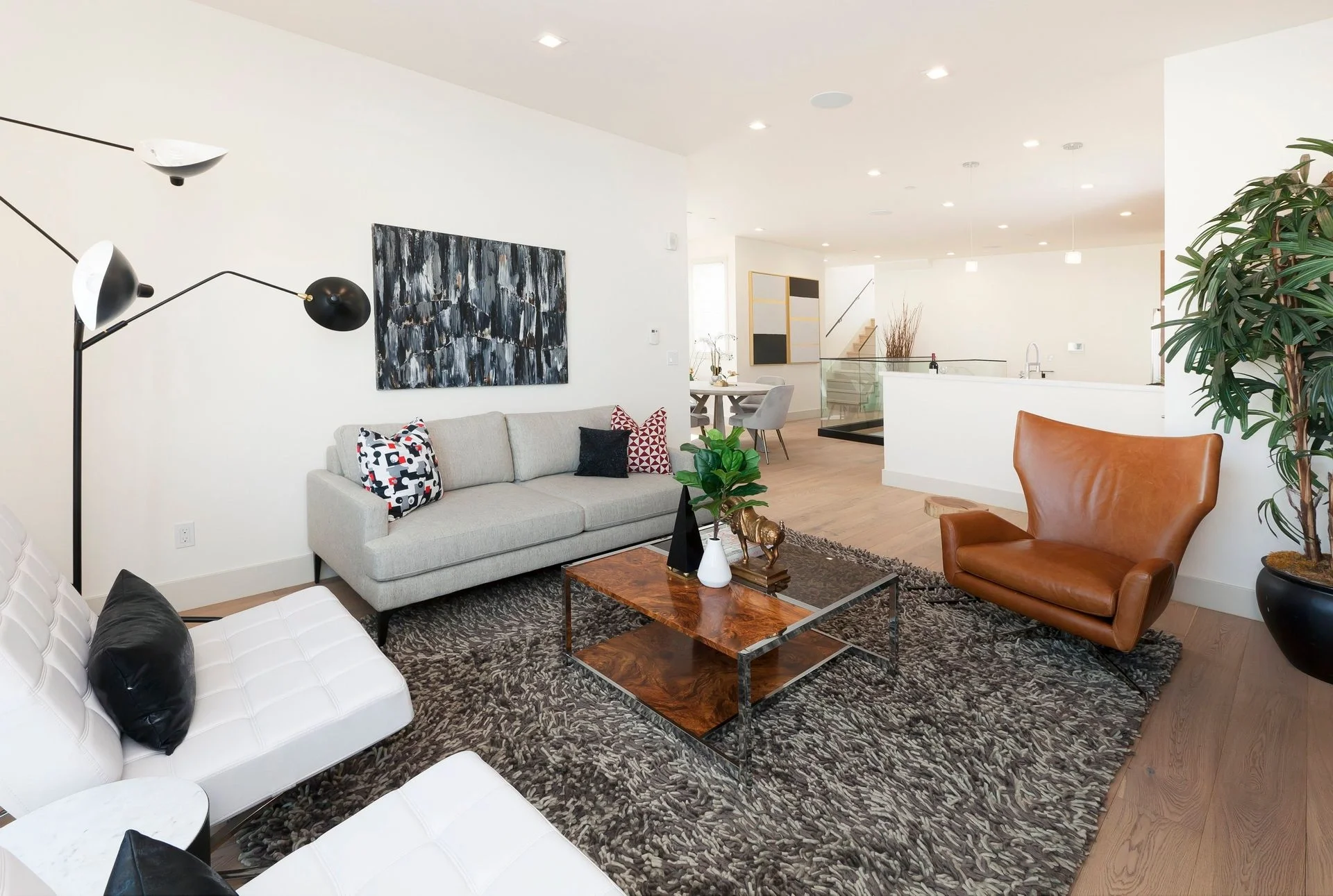 Condo living room remodel with updated flooring, area rug, and modern seating — San Francisco Bay Area general contractor