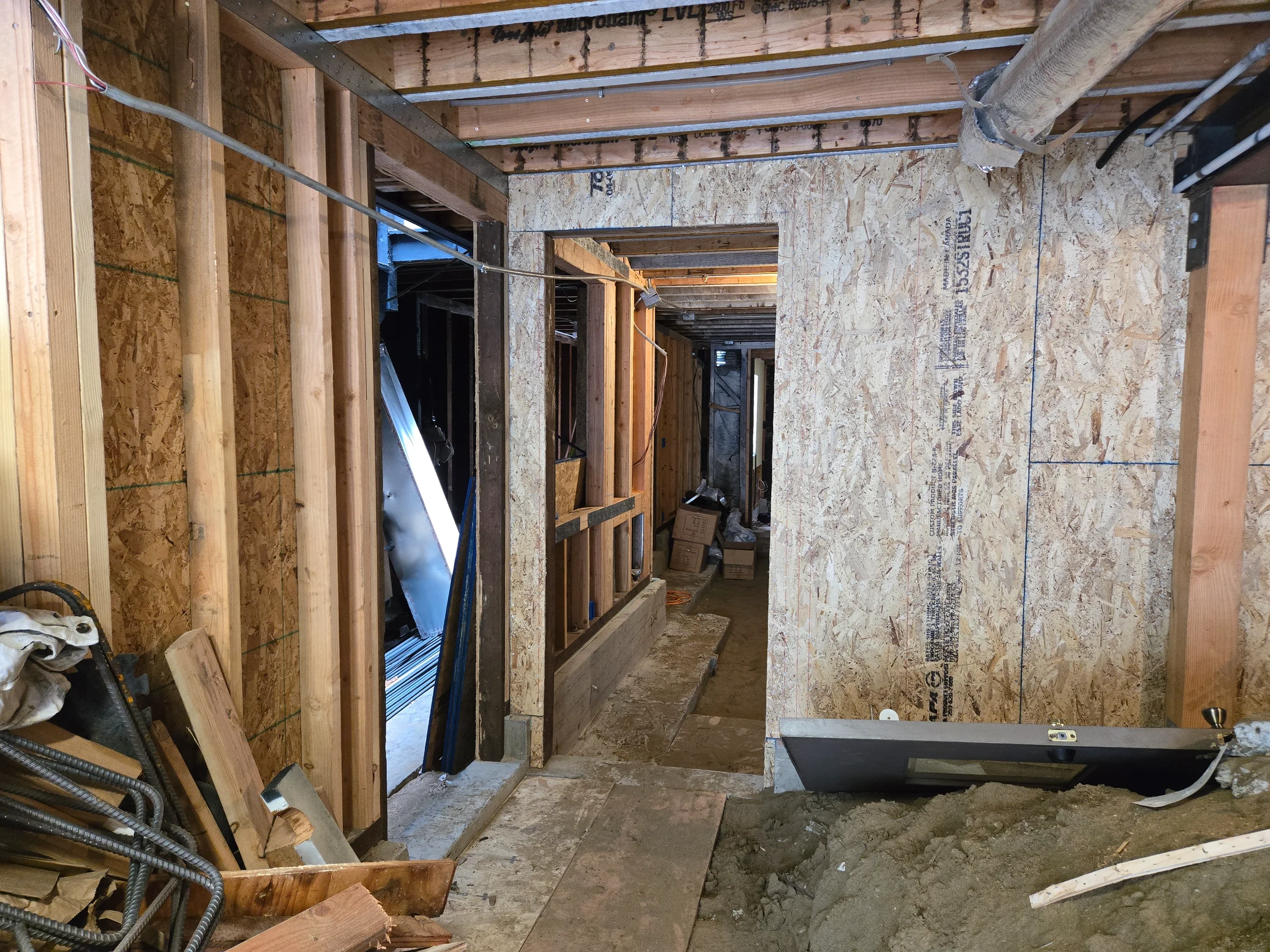 Insulation install in crawlspace wall bays during ground-floor conversion — San Francisco Bay Area general contractor