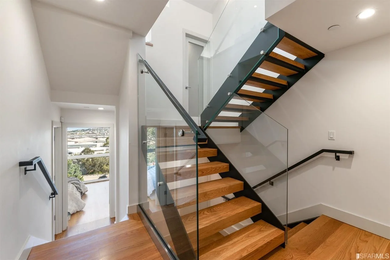 Modern staircase in home addition with wood treads and metal railing — San Francisco Bay Area general contractor
